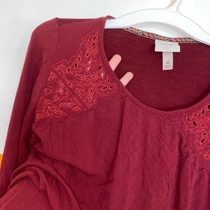 Three-quarter inch long sleeve women’s red top